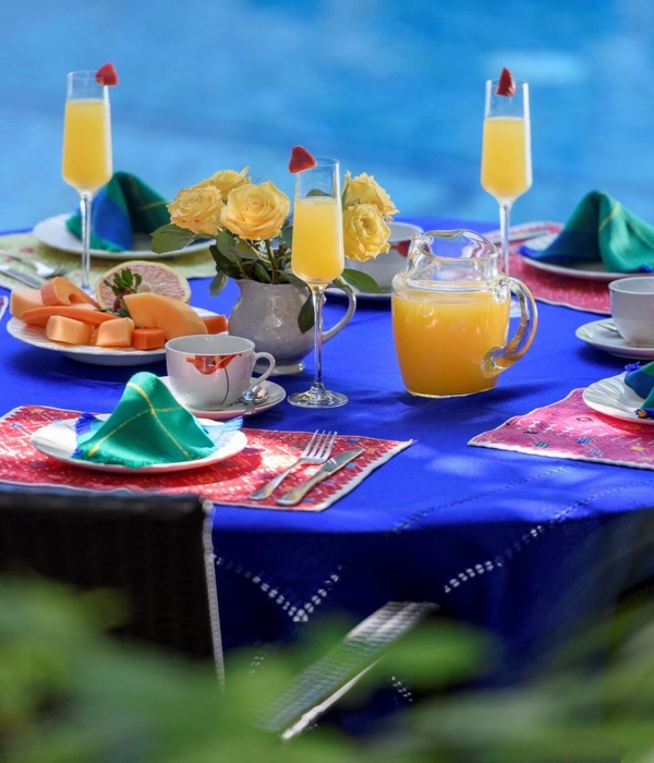 A table set for breakfast at Hacienda Alemana's poolside